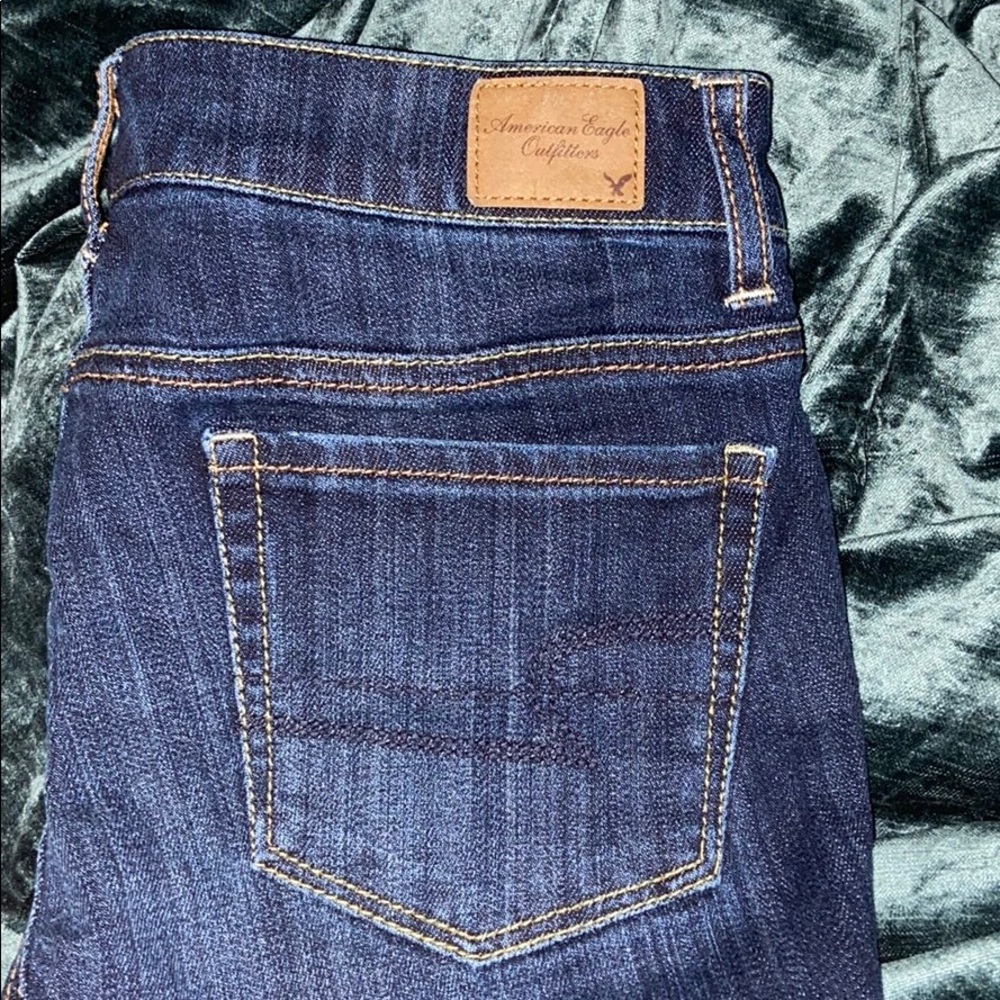 Dark American eagle knee length shorts.